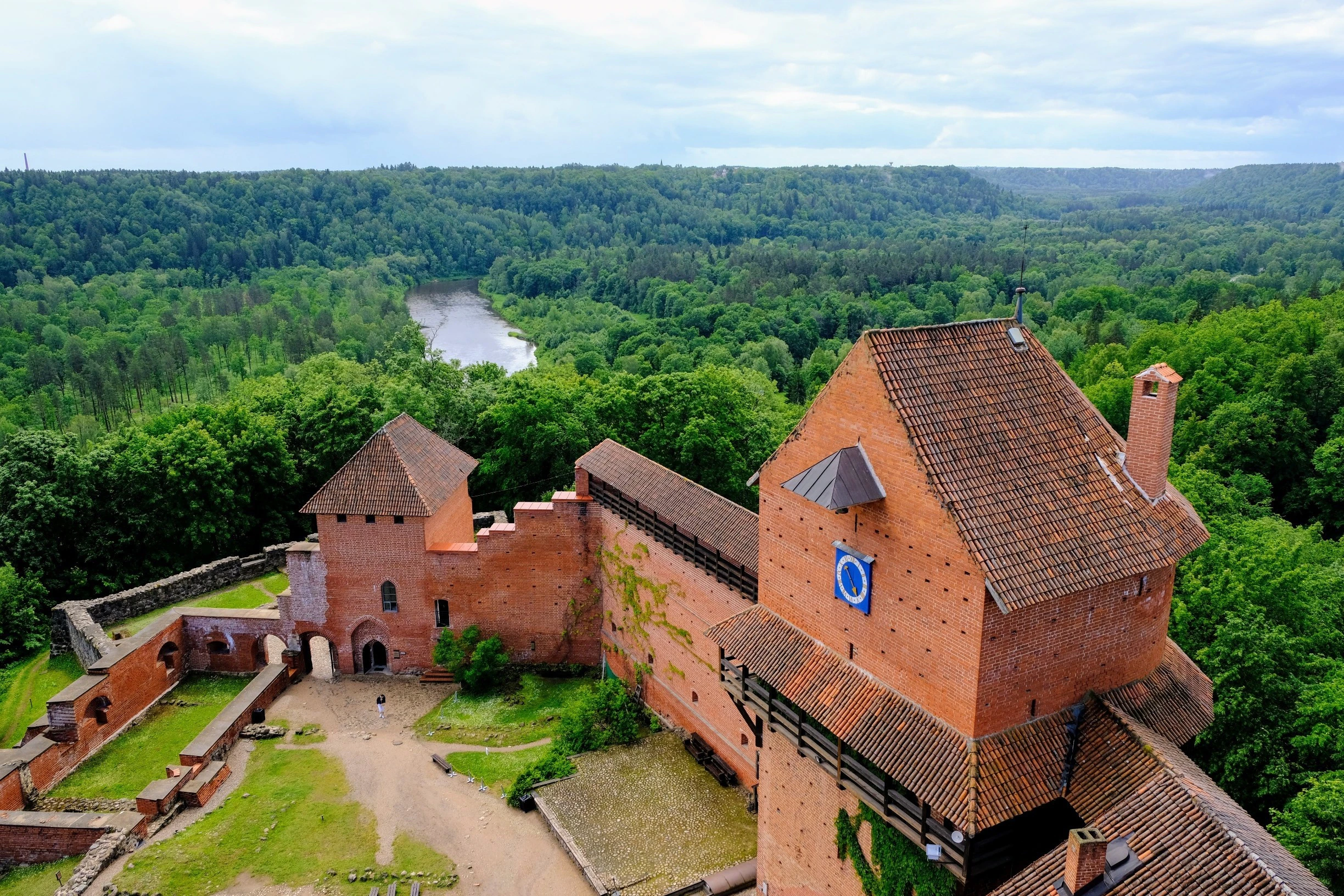 Adventure seekers zip-lining through forests in Sigulda 