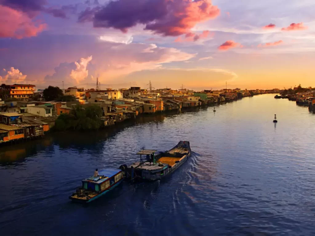 Aerial view of the Mekong River winding through lush landscapes in Laos.